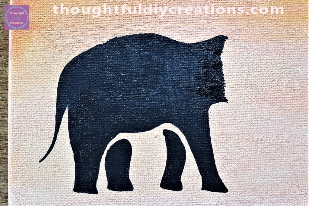 Close up image of the elephant mostly coloured with the paint pen.