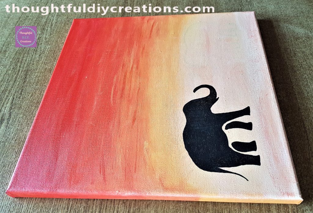 Side view of the first elephant completed on the canvas.