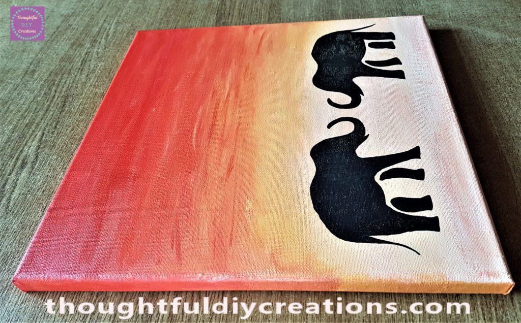 Side view of the elephant sunset painted canvas.