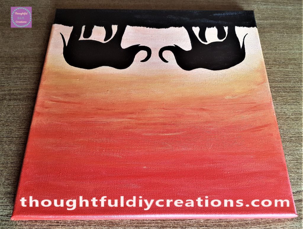 Upside down view of the elephant sunset painted canvas.