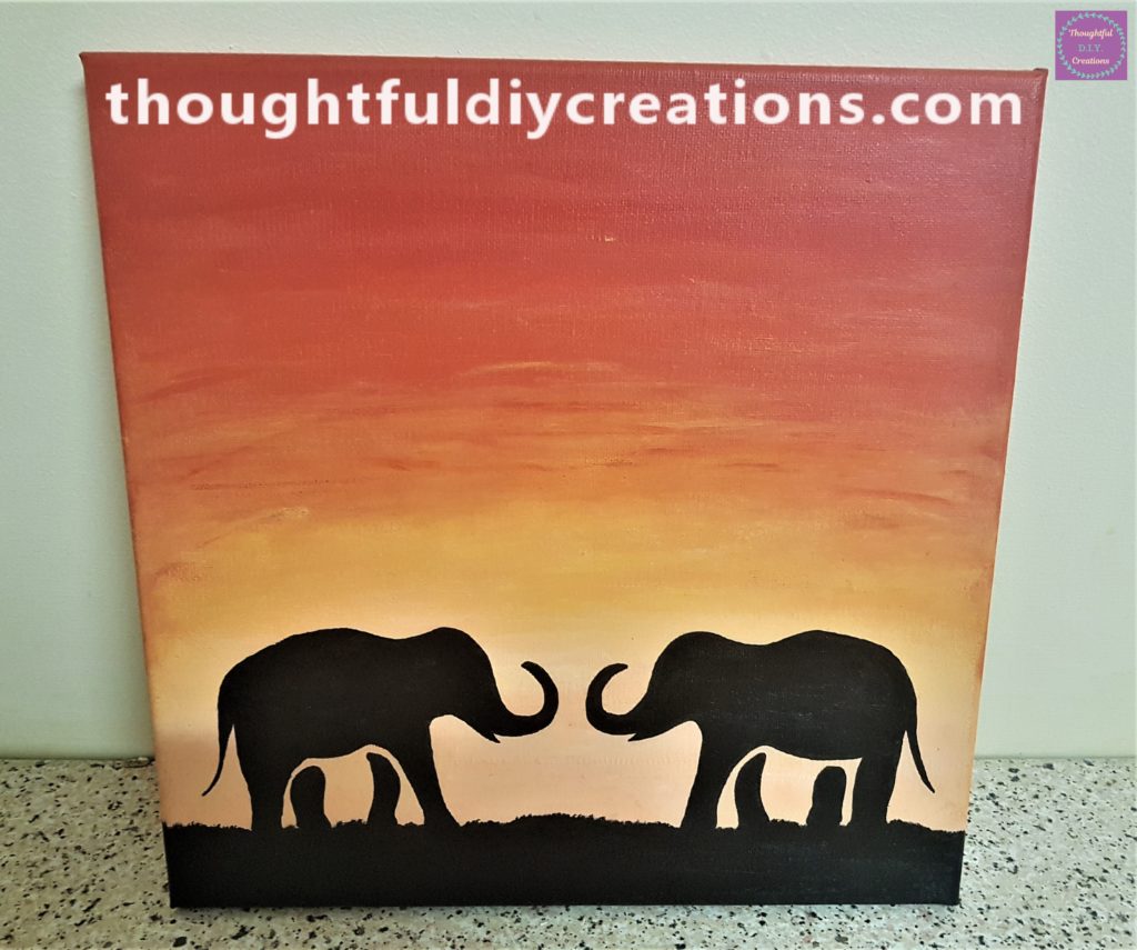 Finished Elephant Sunset Painted Canvas on the worktop leaning against the wall.