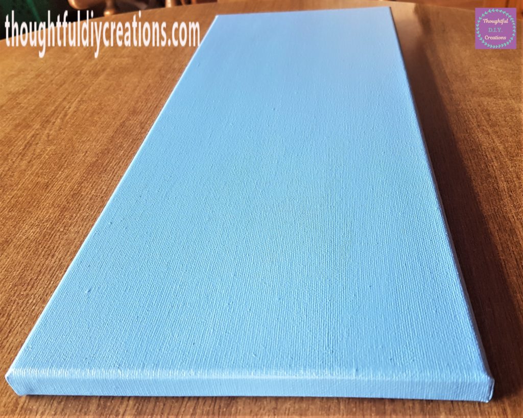 Side view of the Canvas after the second coat of Paint.