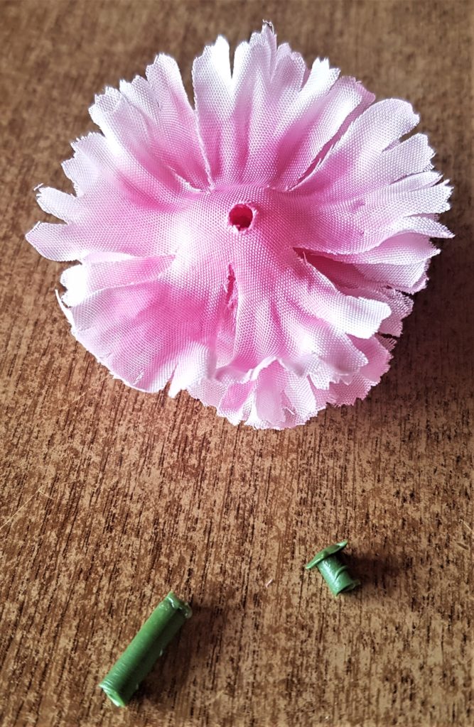 The stem cut from the flower. The top green part removed from the center of the flower.