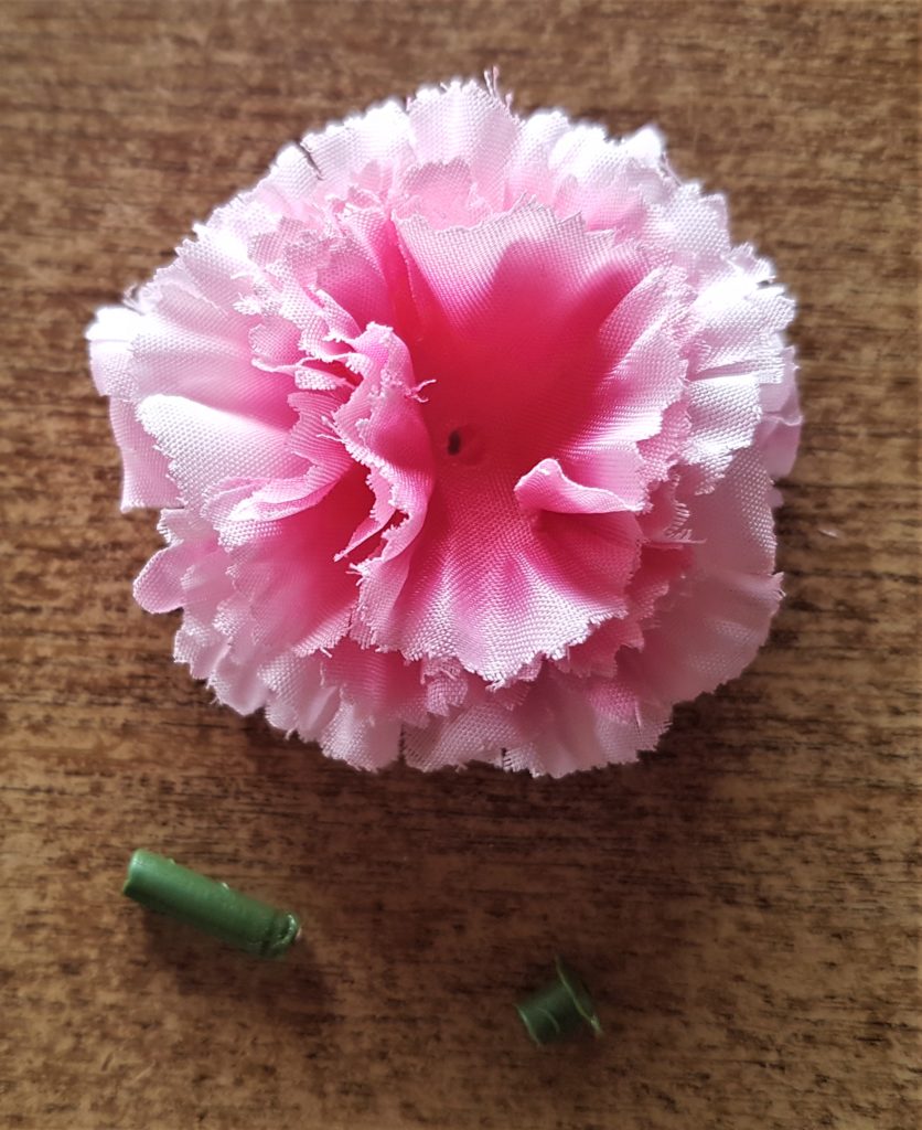 The flower turned back to it's front with the stem and green part removed.