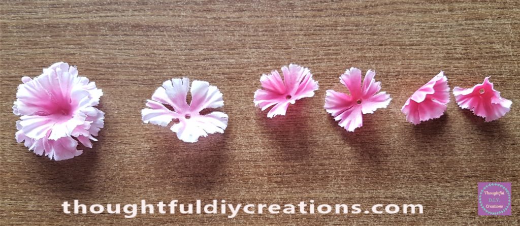 The center of the next petal hot glued to the flower.