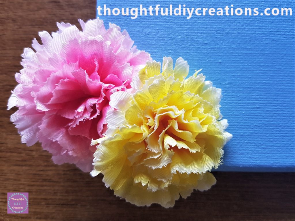 Close-up image of the hot glued Pink and Yellow Flower.
