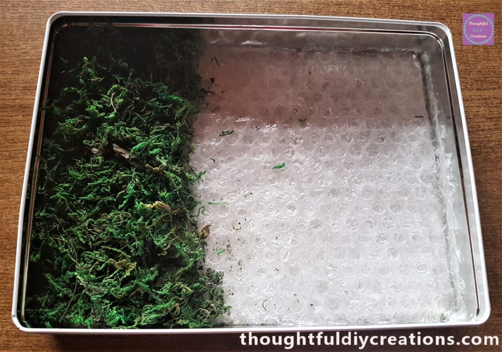 The next section filled in with hot glue and moss.