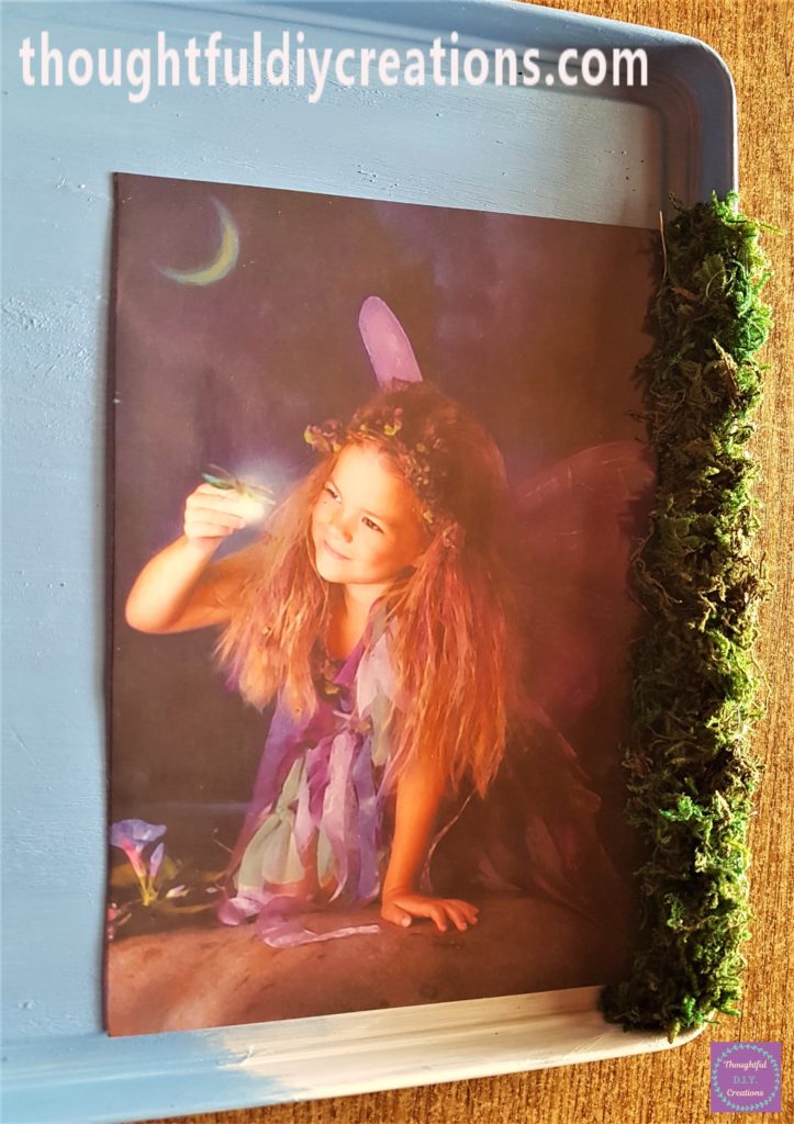 More hot glue and moss added until 1 section of the frame was completed.