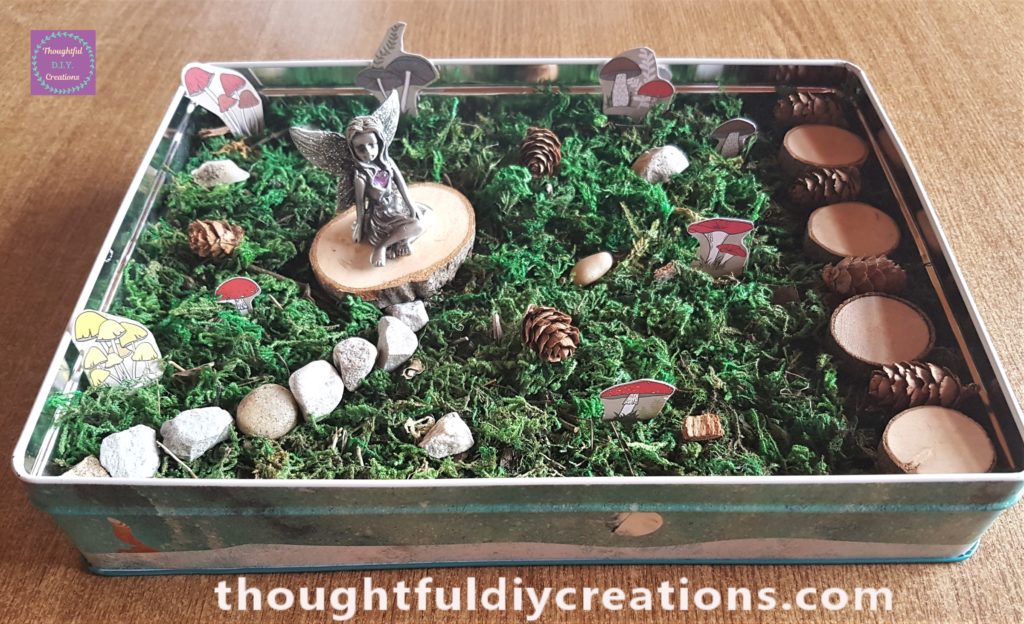 The mushrooms placed down into the moss. I spaced them around the fairy garden.