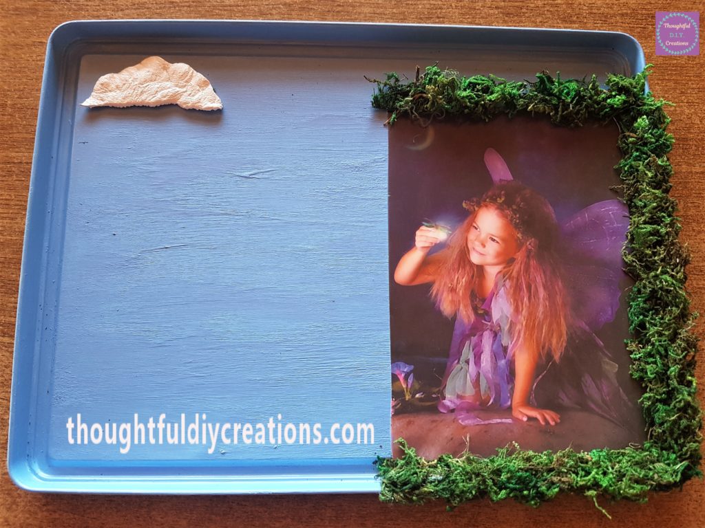 More hot glue and moss added to the top of the fairy image.