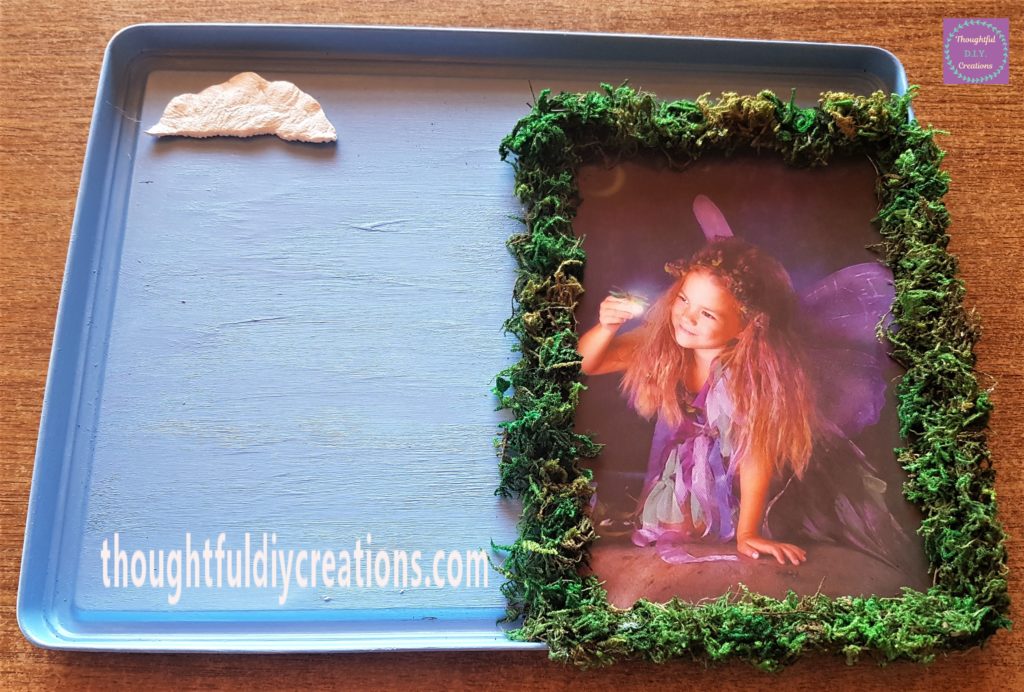 Adding more dried moss to the last section of the Fairy.