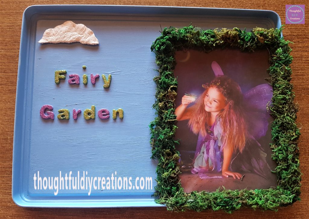 The words 'Fairy Garden' made out of the stickers and attached to the lid.