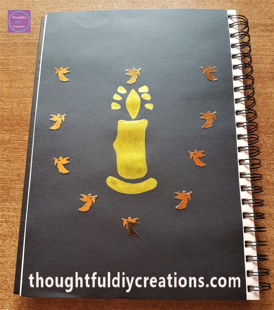 10 Gold Angels stuck down to the Art Journal using Pritt Stick.