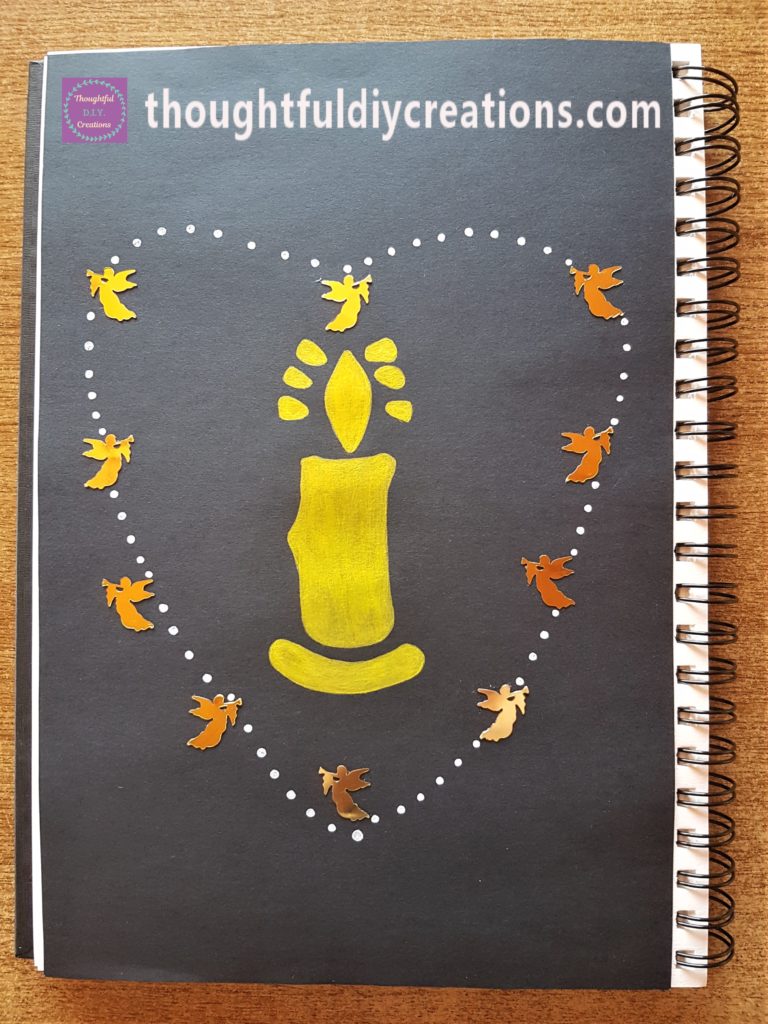 White Paint Pen used to make polka dots around all of the Angels forming a Heart Shape.