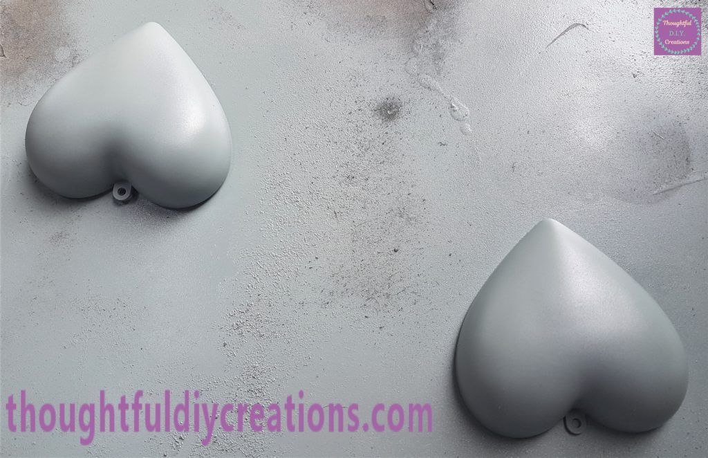 Second layer of grey spray paint applied to the hearts an hour later.