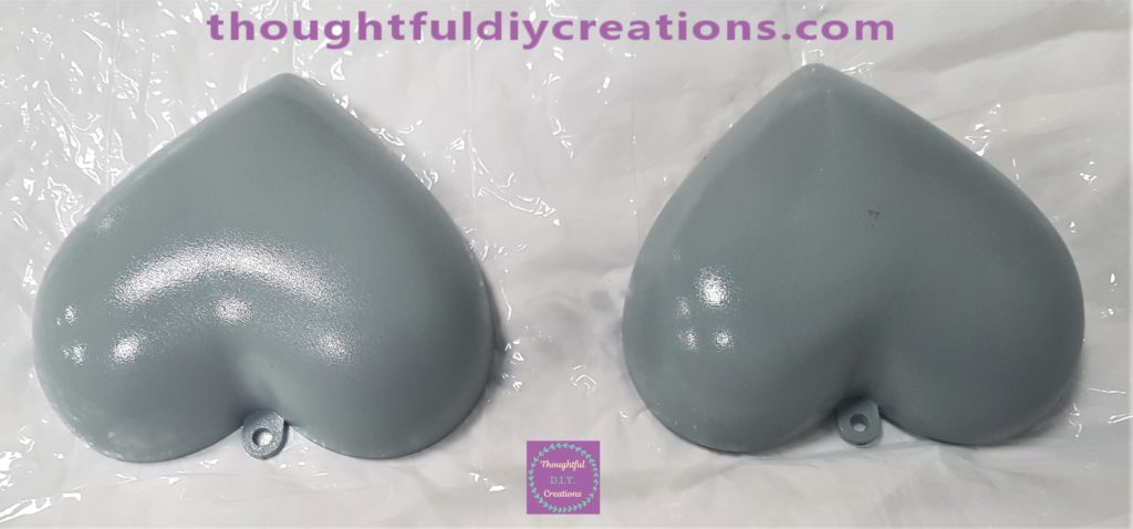 A layer of top coat sprayed onto the outside of the hearts.