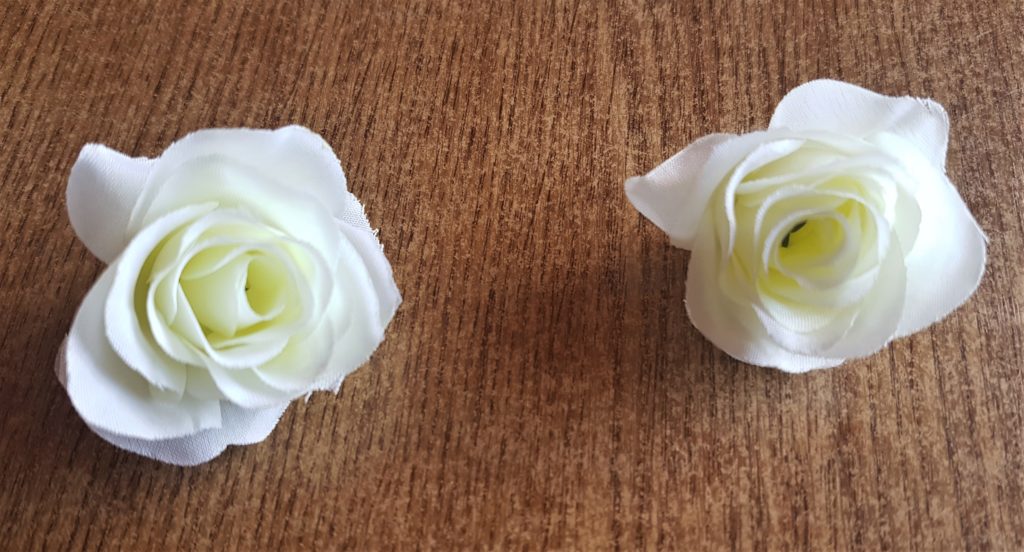 2 heads pulled from their stems and excess stalk cut off.