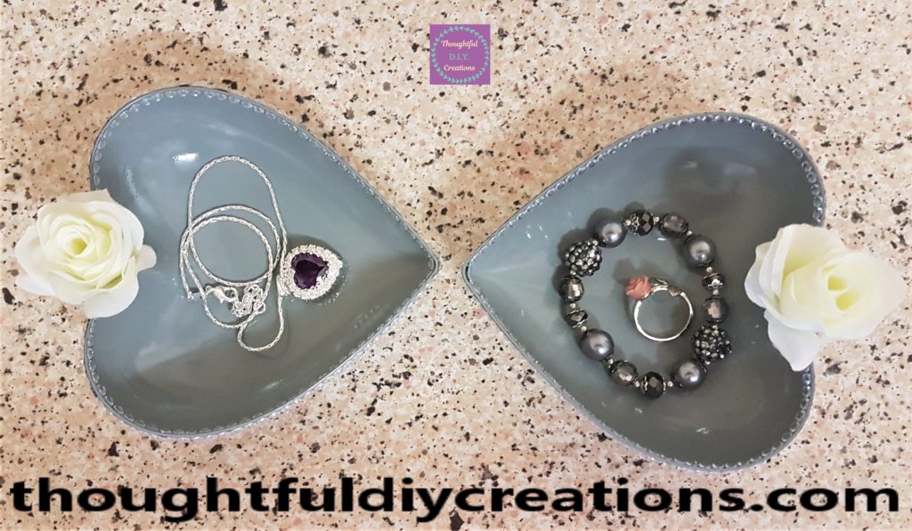 Up-cycled hearts facing each other.