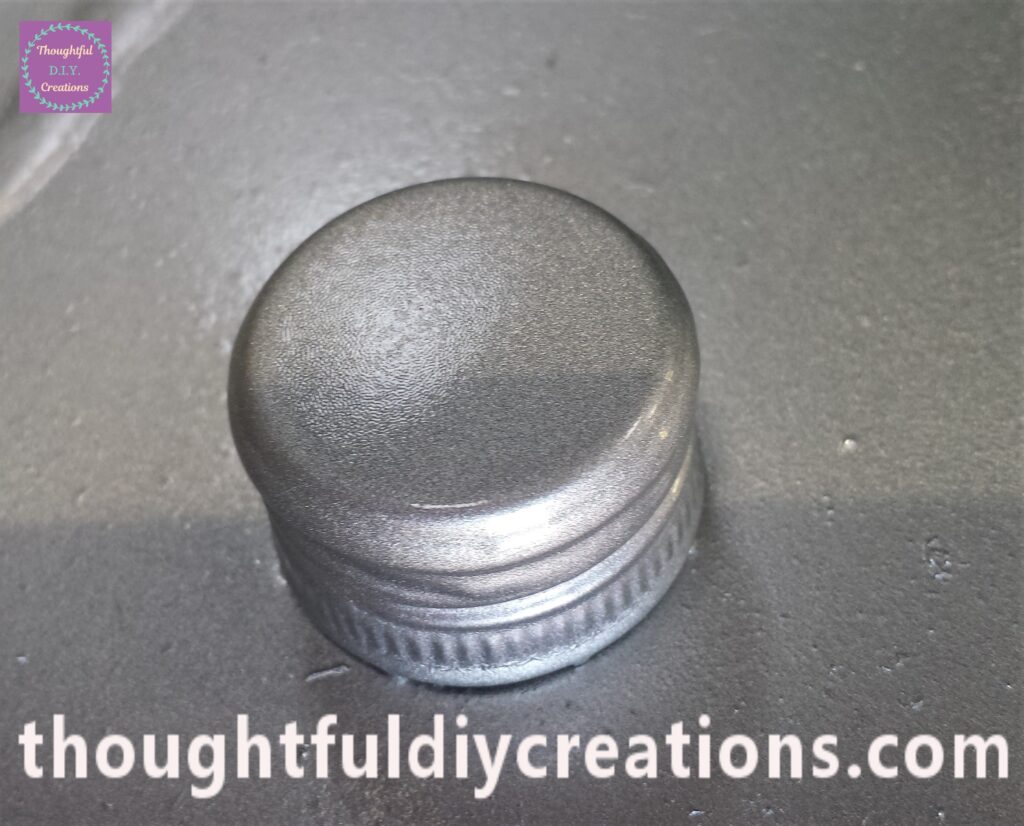 Final layer of spray paint on the lid.