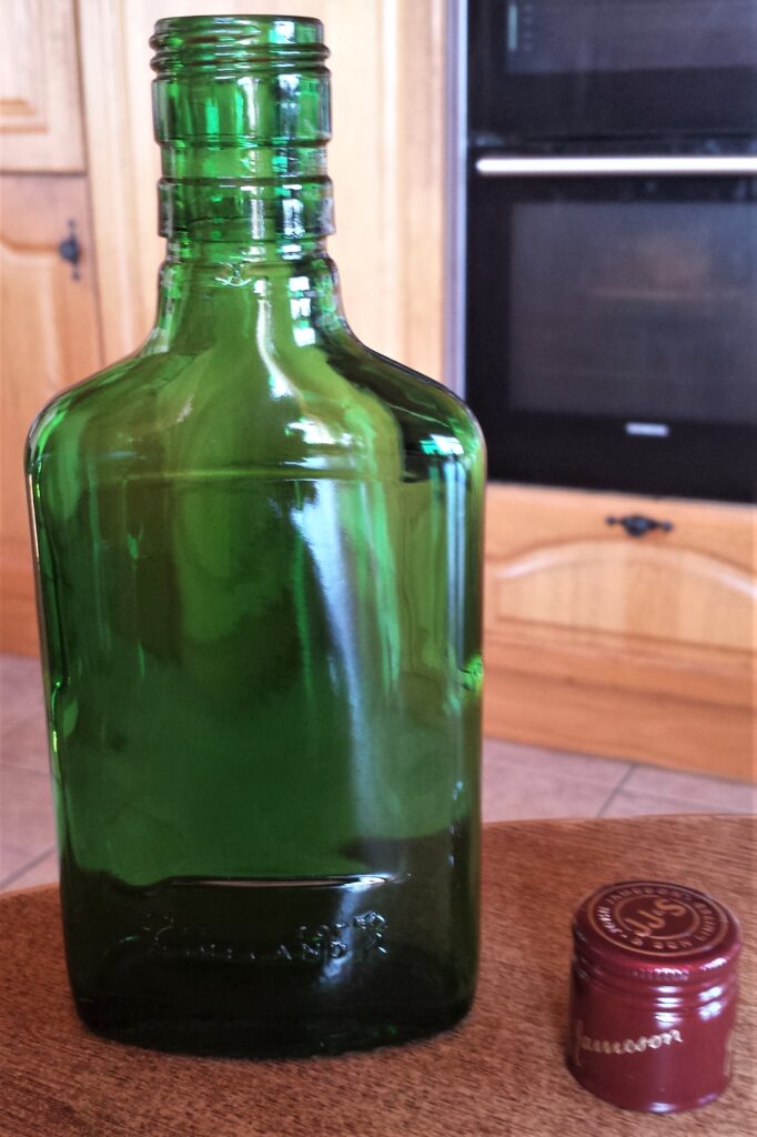 Whiskey Bottle and Lid after being soaked in the sink, label removed, rinsed and dried.