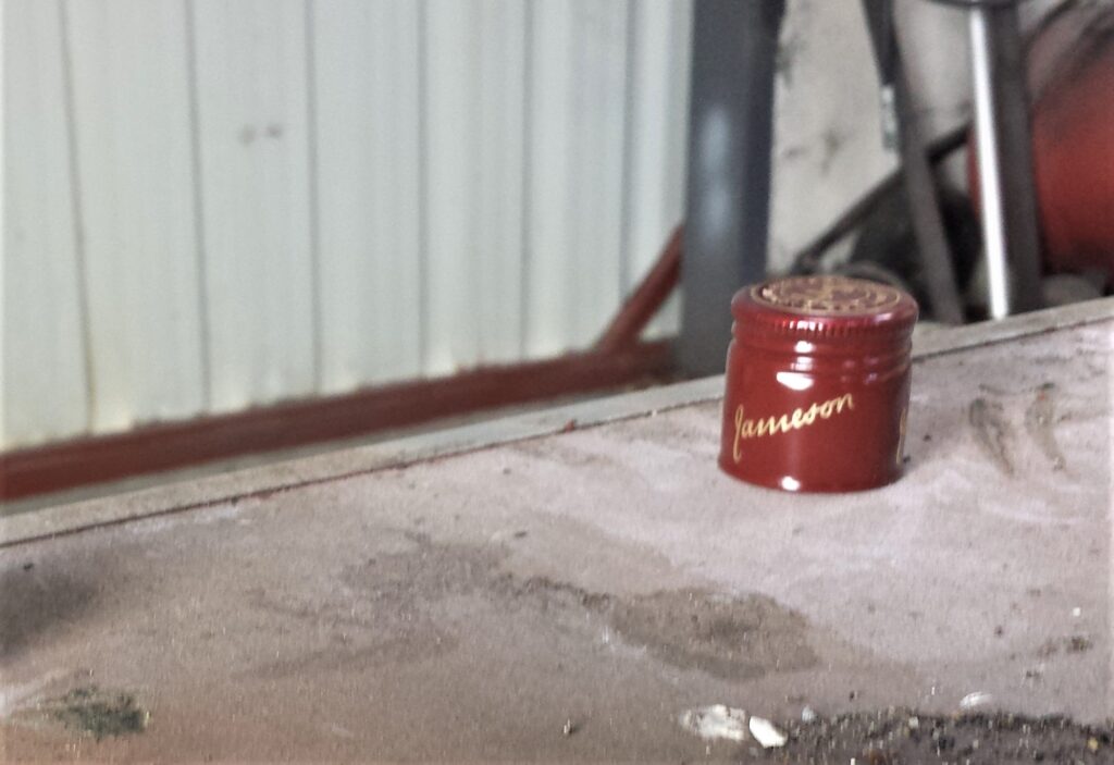 Lid of the Bottle on the Table.