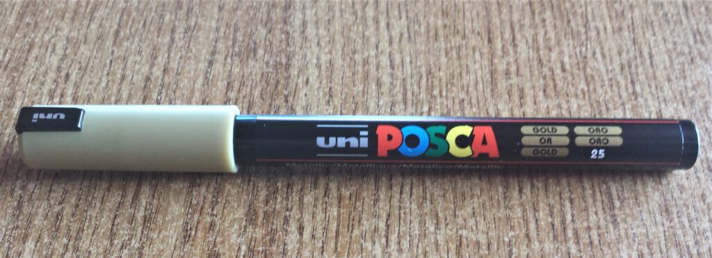Gold uni POSCA Acrylic Paint Pen 0.7 mm.