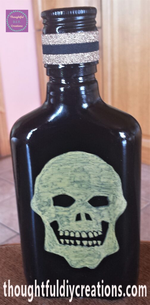 Tacky PVA Glue added to the ribbon and attached to the lid of the bottle.