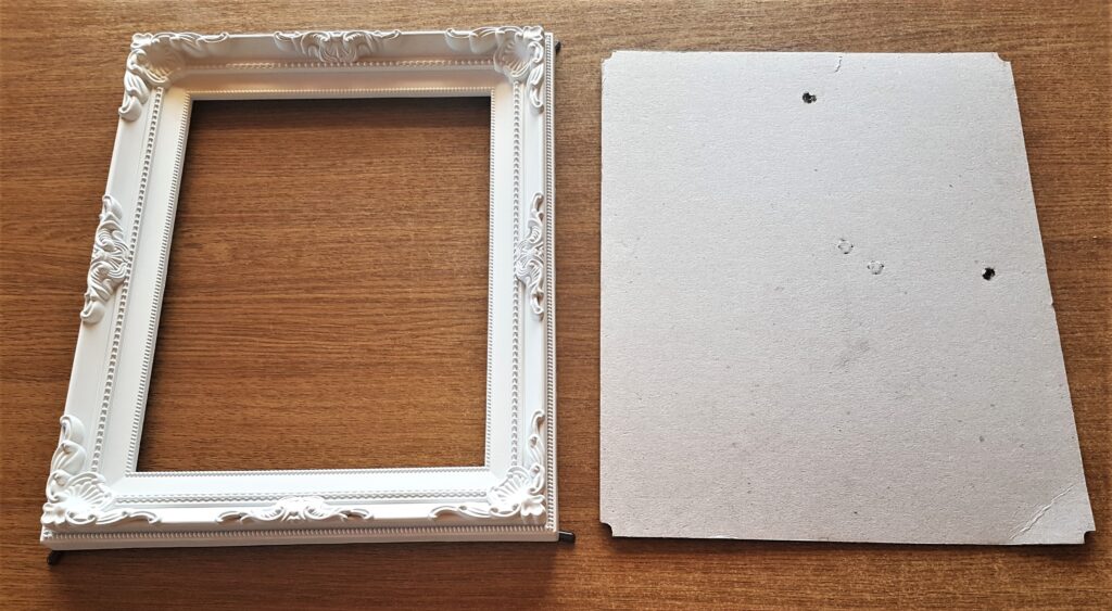 The Glass and the Picture of the Pink Roses removed from the Frame.