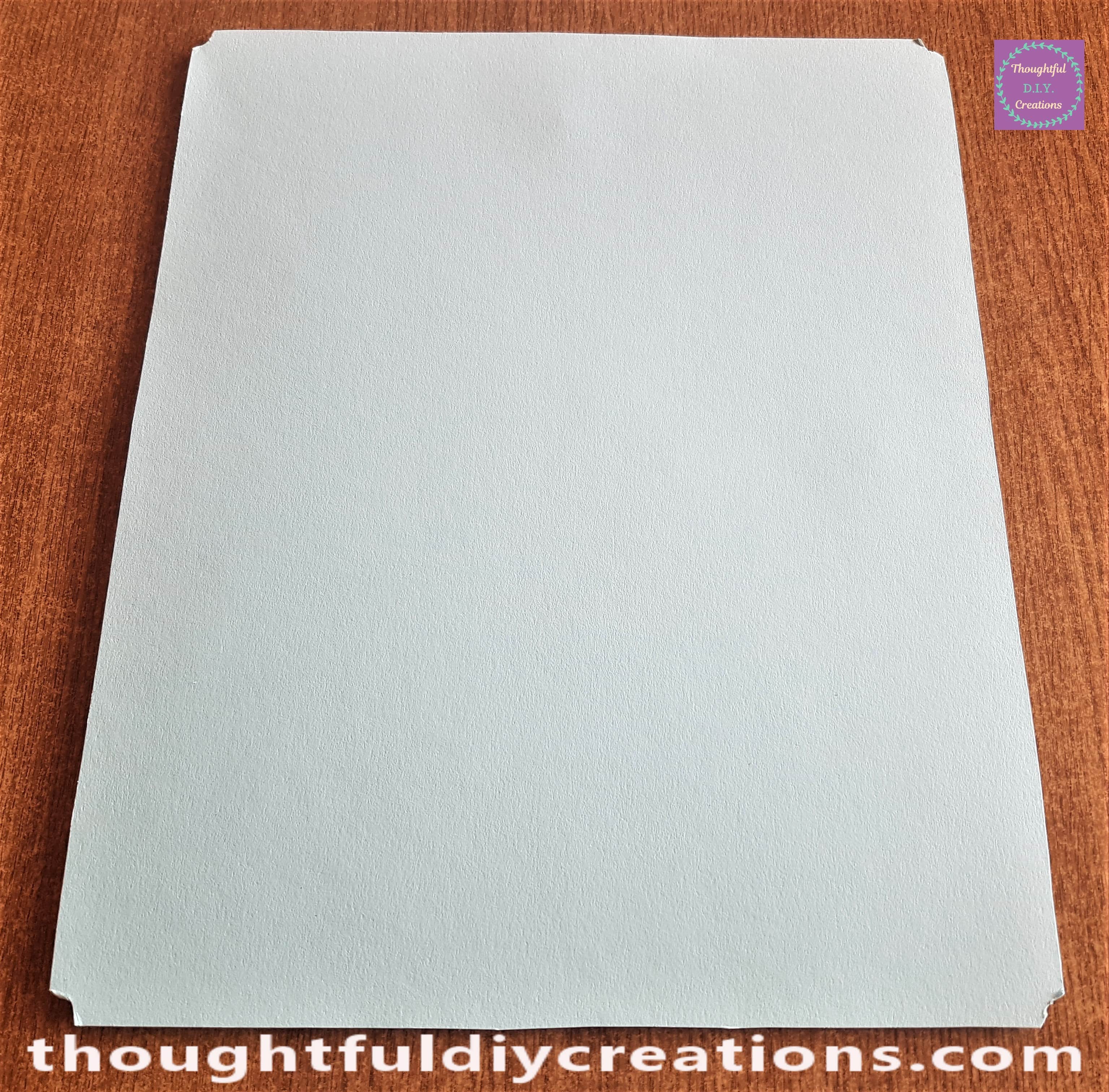 The excess blue card cut from the frame.