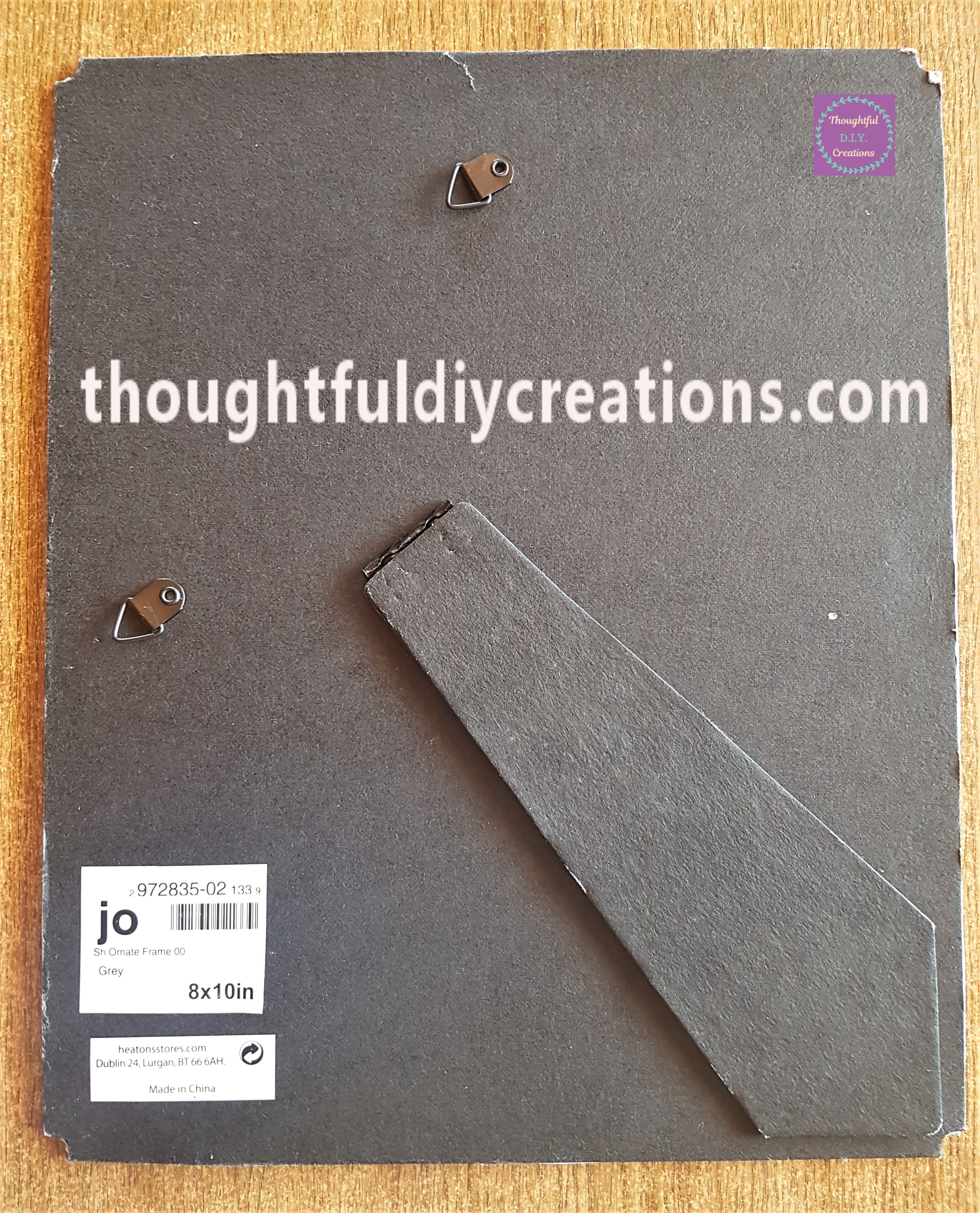 Back of the frame with the blue card attached to the other side.