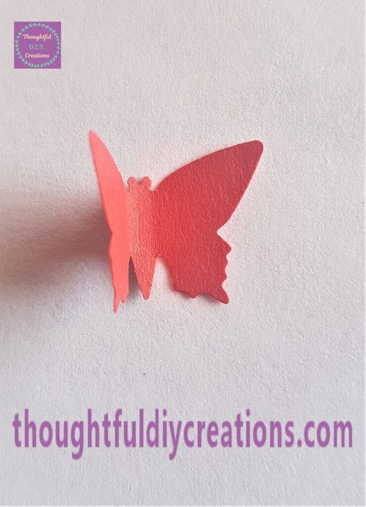 Wings of a red butterfly pressed forward to look 3-D.