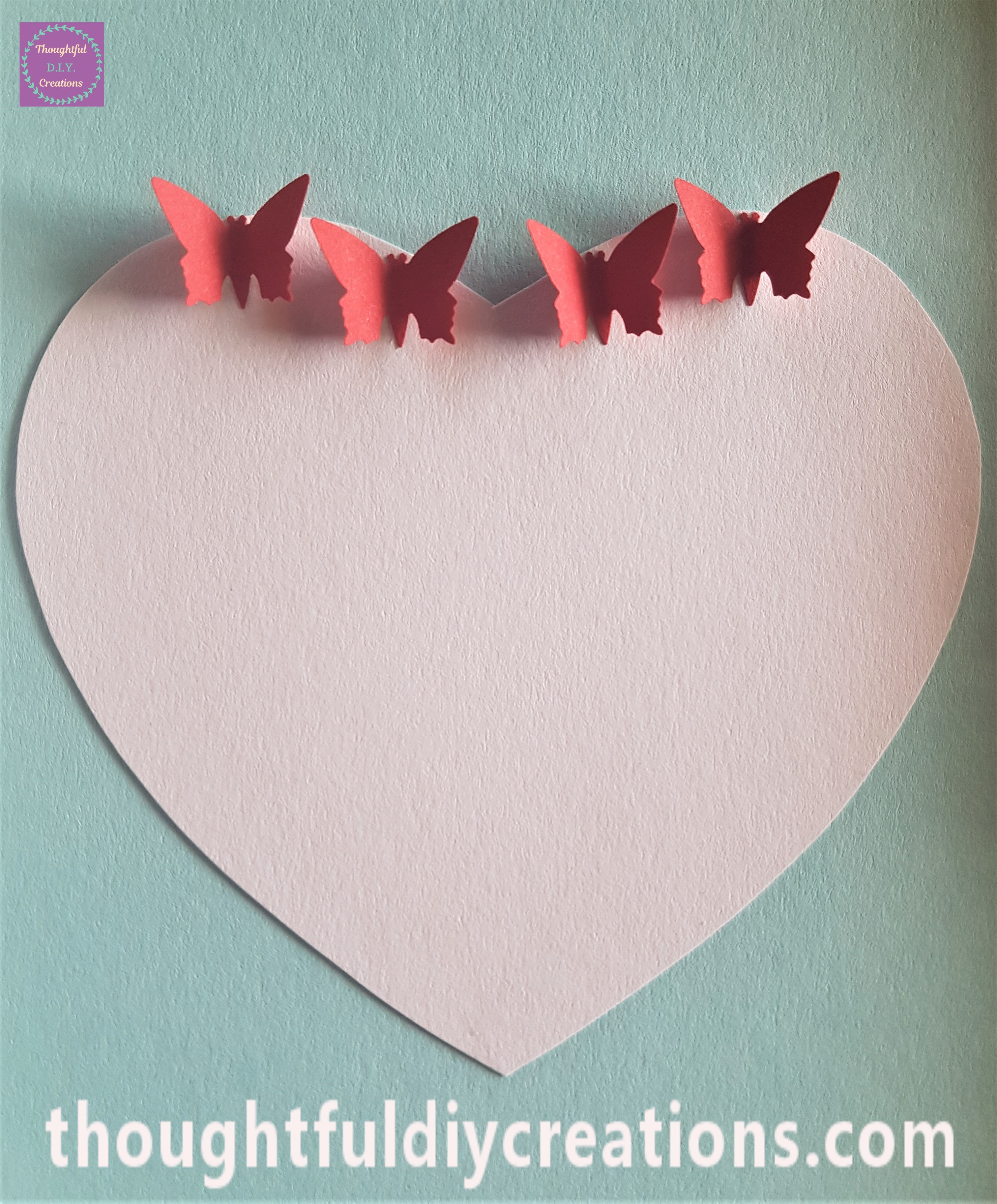 Anita's Tacky Glue on the back of the butterflies and pressed into the top of the heart.