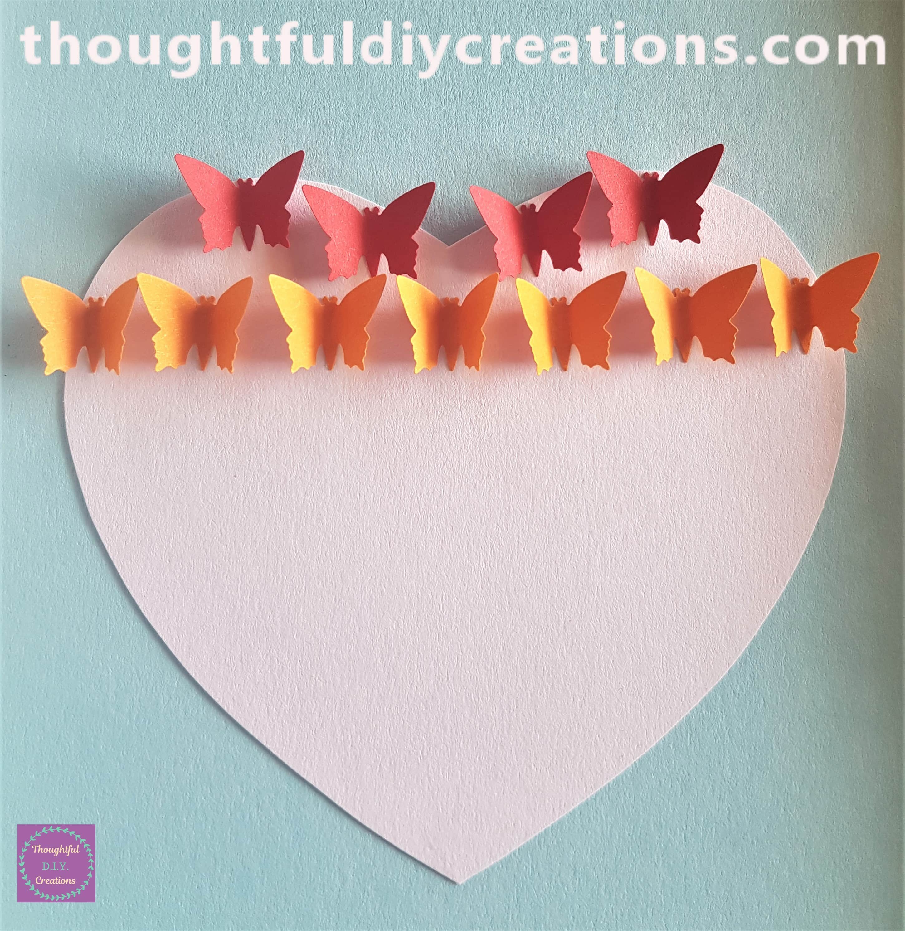 7 orange butterflies attached to the heart.