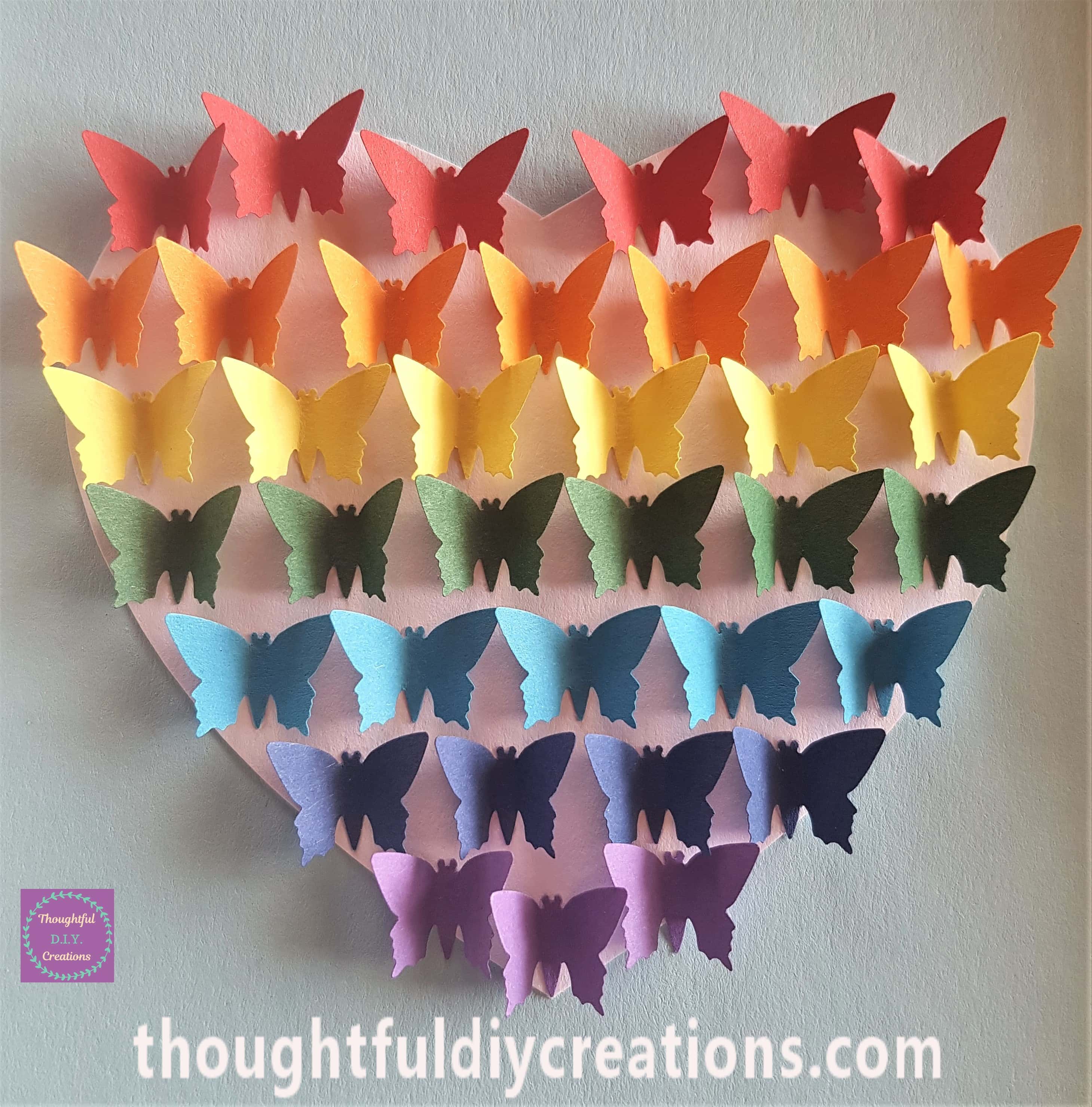 2 more red butterflies added to the top of the heart and 2 more violet butterflies added to the bottom of the heart.