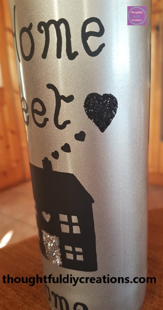 Side view of the bottle, glitter love heart.