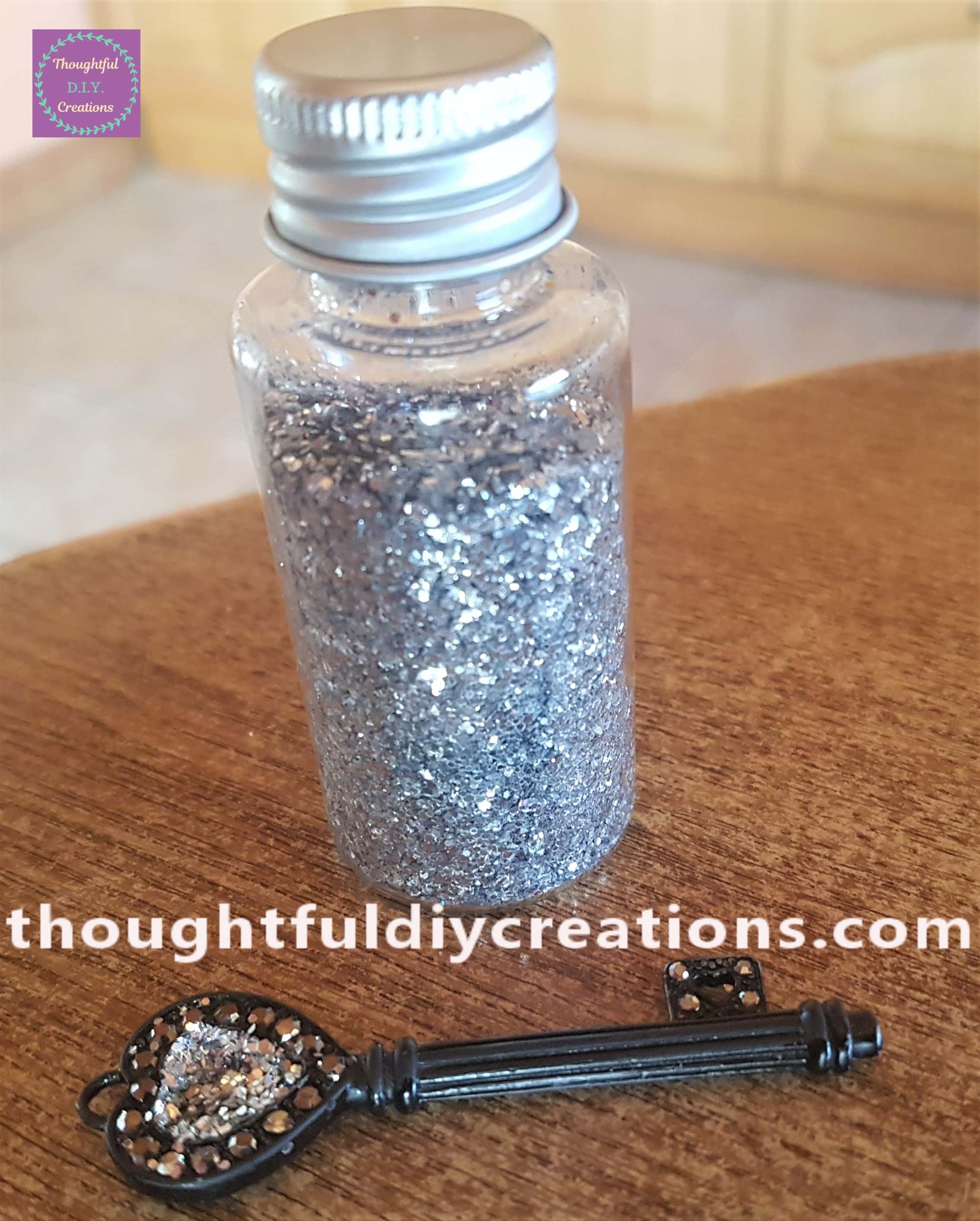 Silver Glitter poured onto the glue on the key.