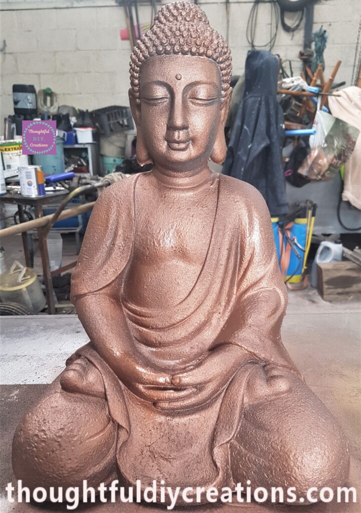 Second Layer of Spray Paint applied to the Buddha an hour later.