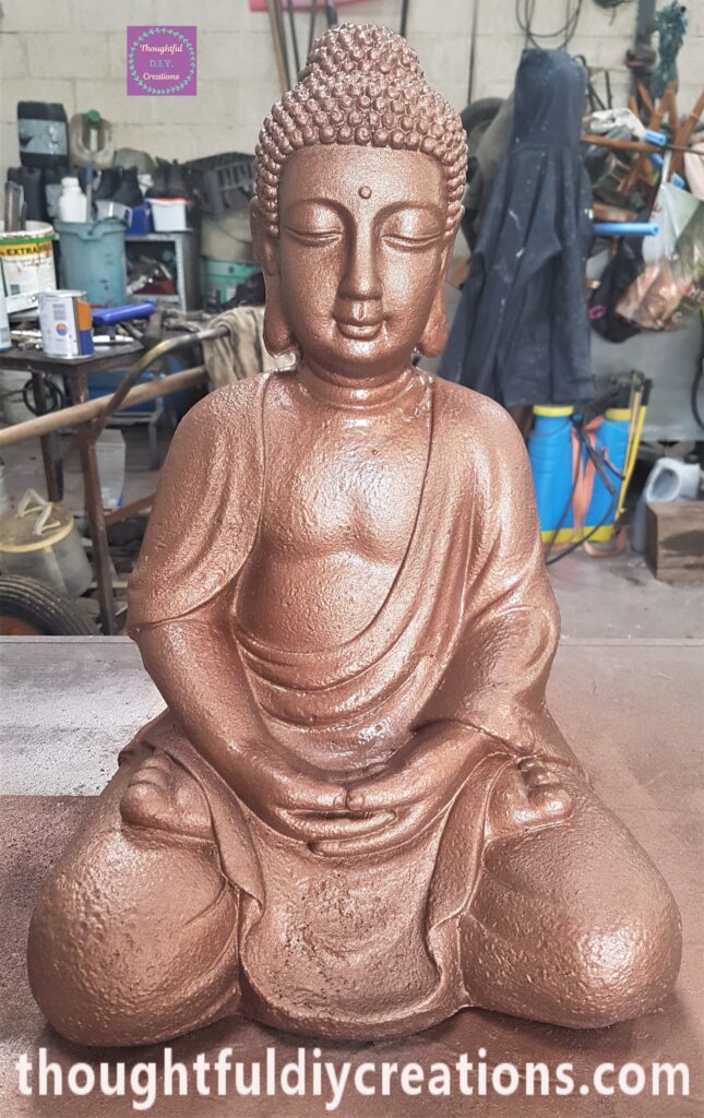 Third and final layer of Spray Paint applied to the Buddha.