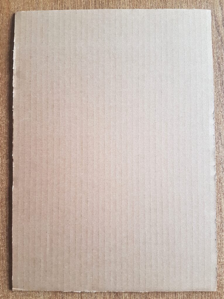 Cardboard cut out with a strong scissors.