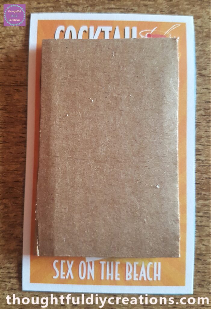 The glued Cardboard attached to the back of the first Cocktail Picture.