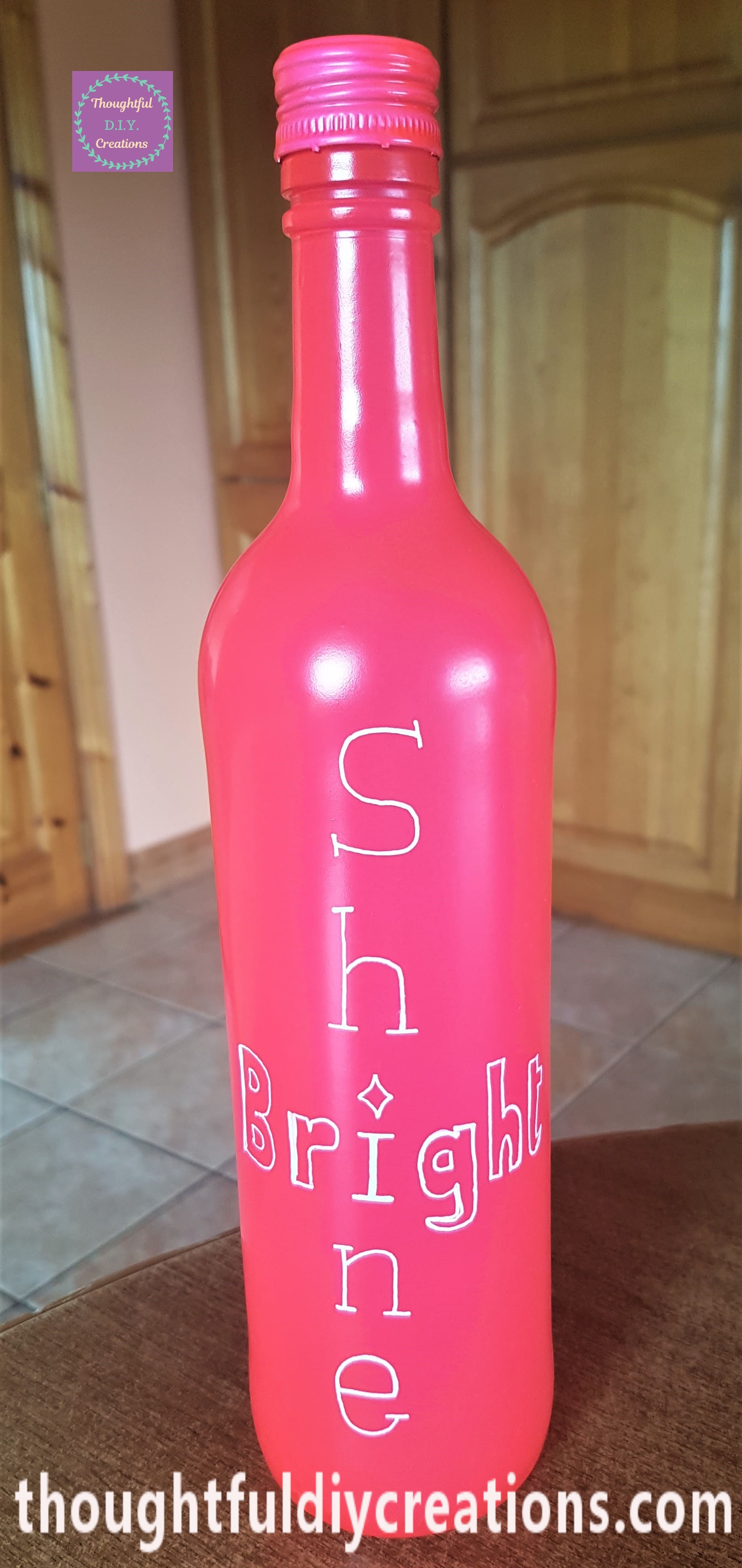 The word 'Bright' written across the Bottle joining with the word 'Shine'.