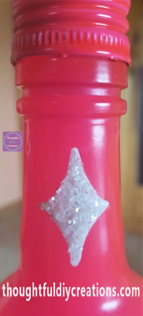 Tacky Glue on the Diamond Shapes and White Glitter sprinkled over the Glue.