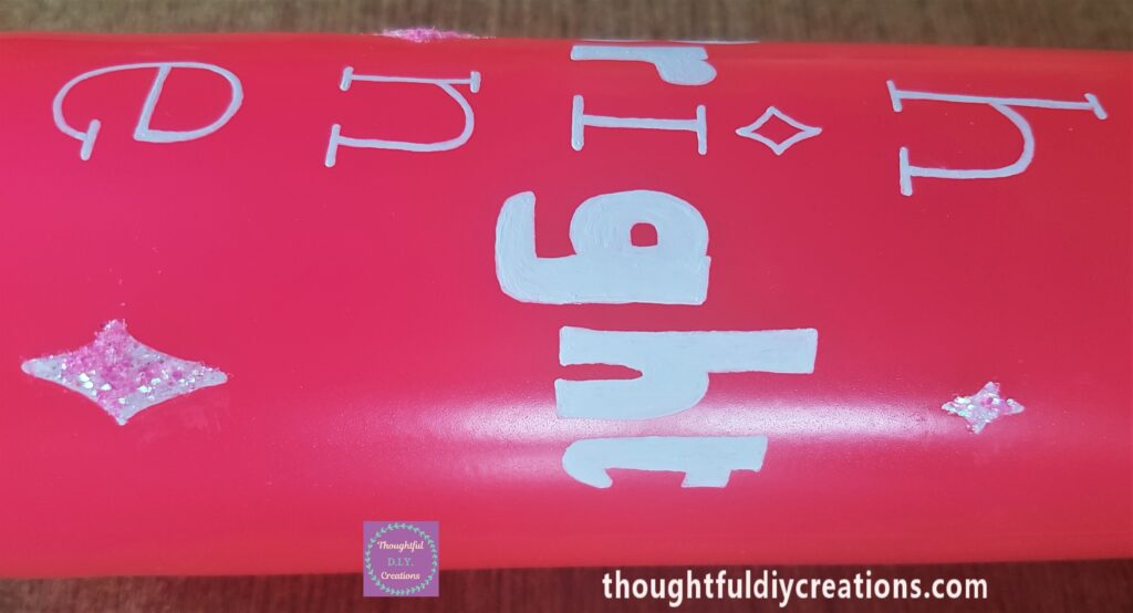 Tacky Glue added to the 4 smaller diamonds and Pink Glitter sprinkled over the glue.