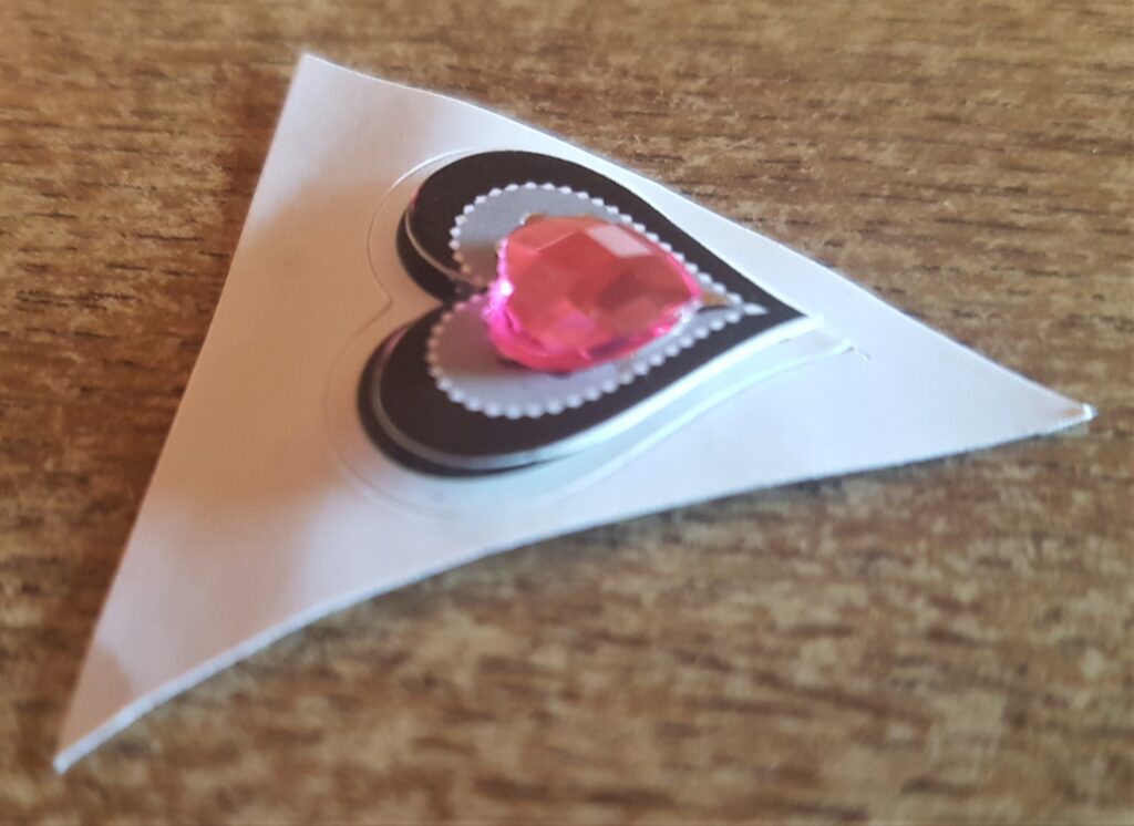 Pink love heart diamond on a sticker.