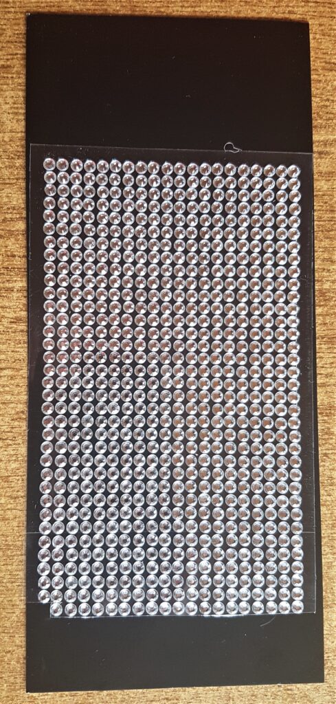 Clear self-adhesive gemstones.