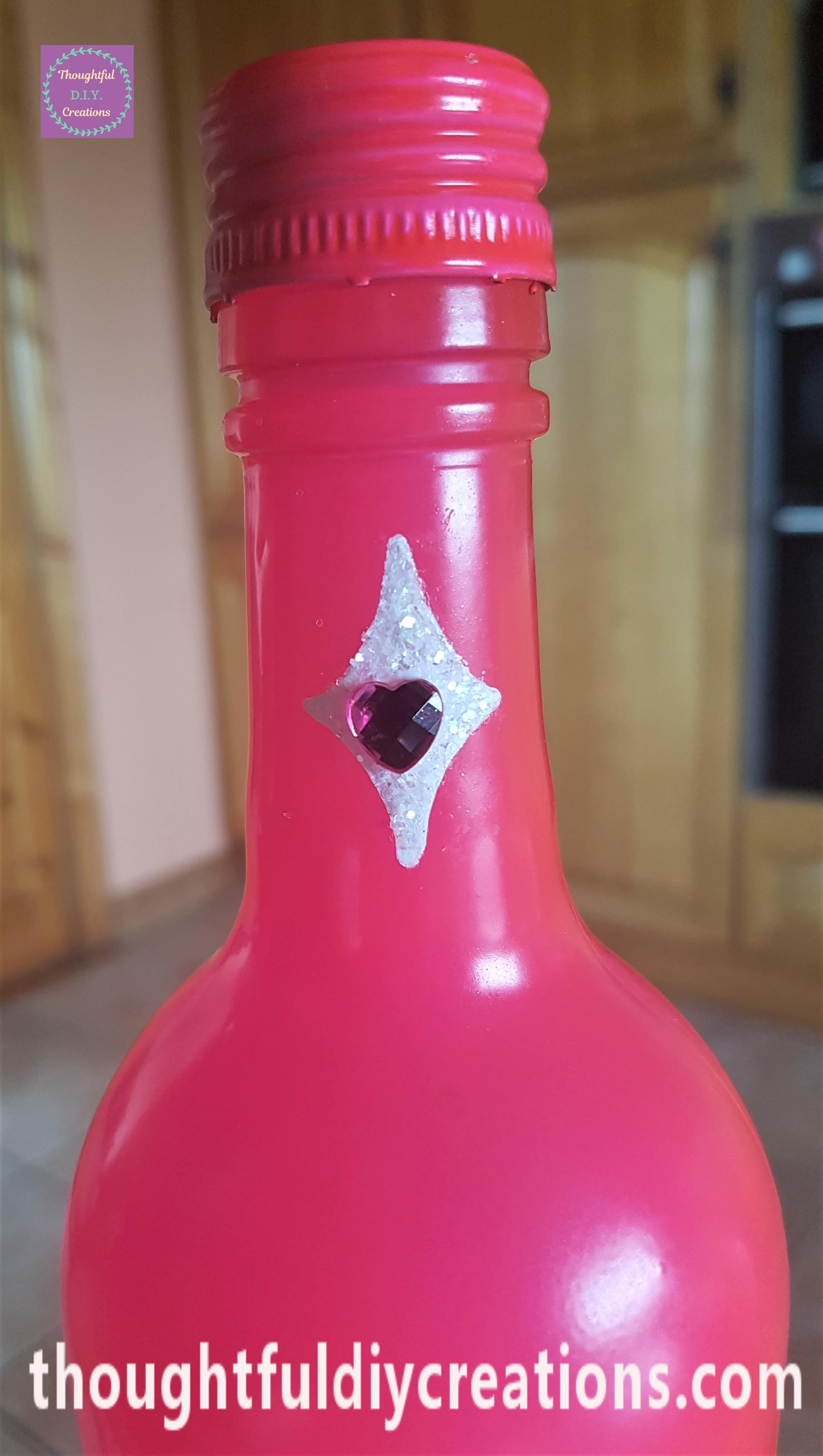 Pink love heart attached to the white glitter diamond with tacky glue.