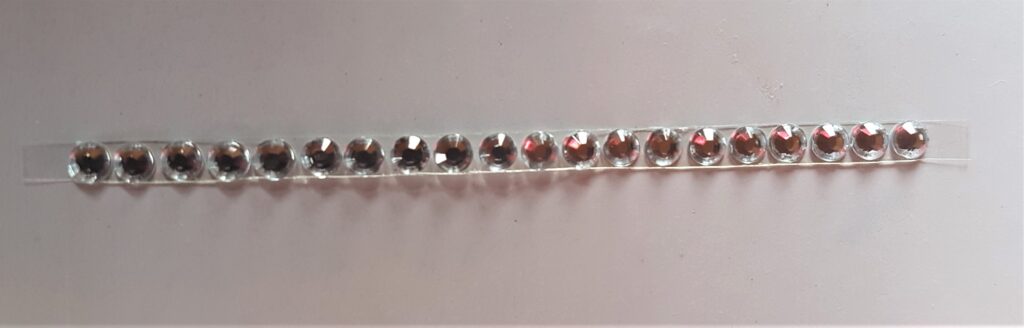 A row of gemstones cut off.