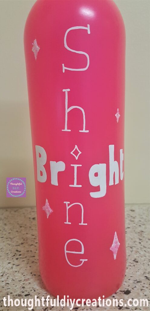 Main part of the Pink Spray Painted Bottle showing the quote.