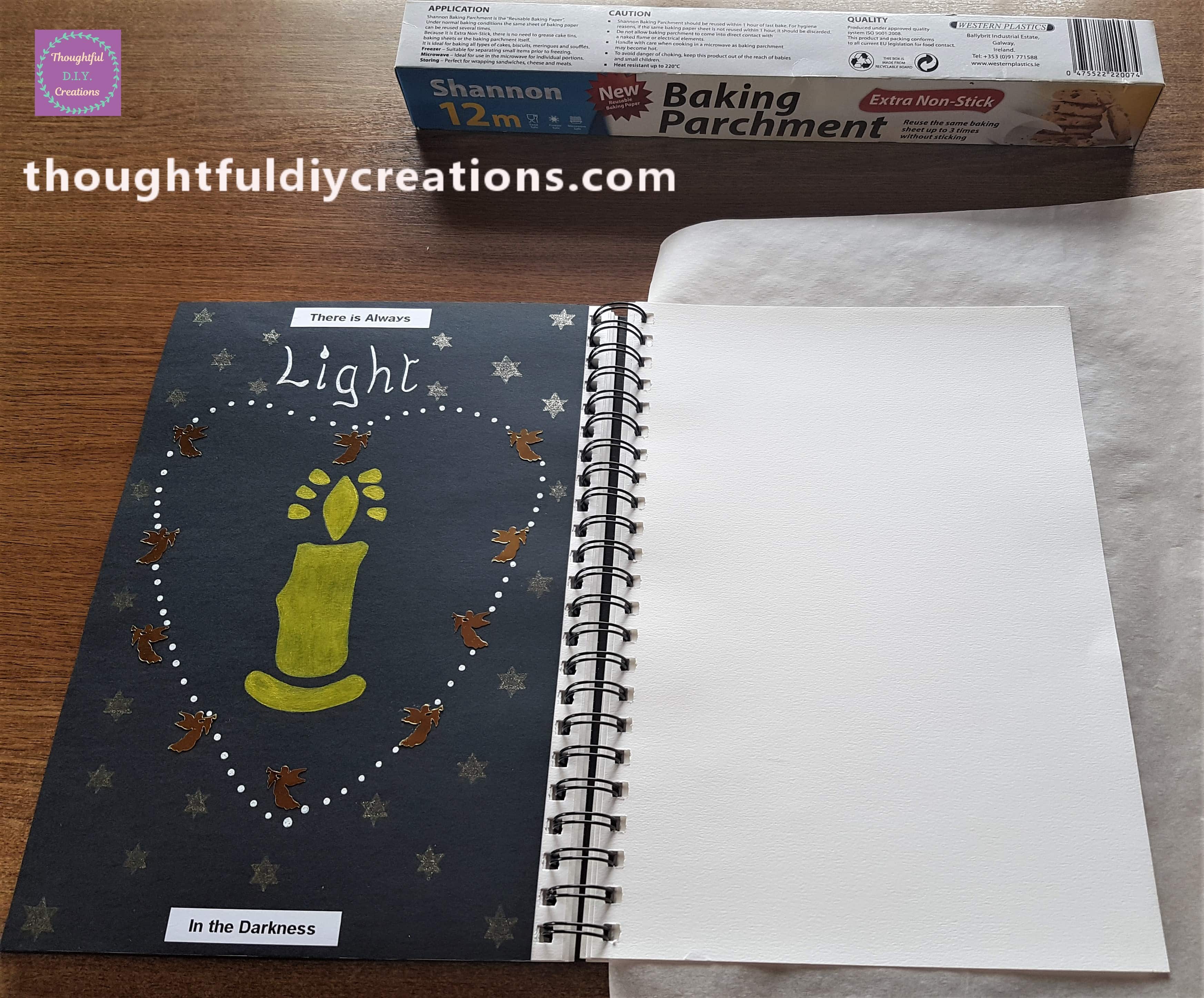 Baking Parchment Paper under the Page I'm working on to prevent Paint getting on the other pages.