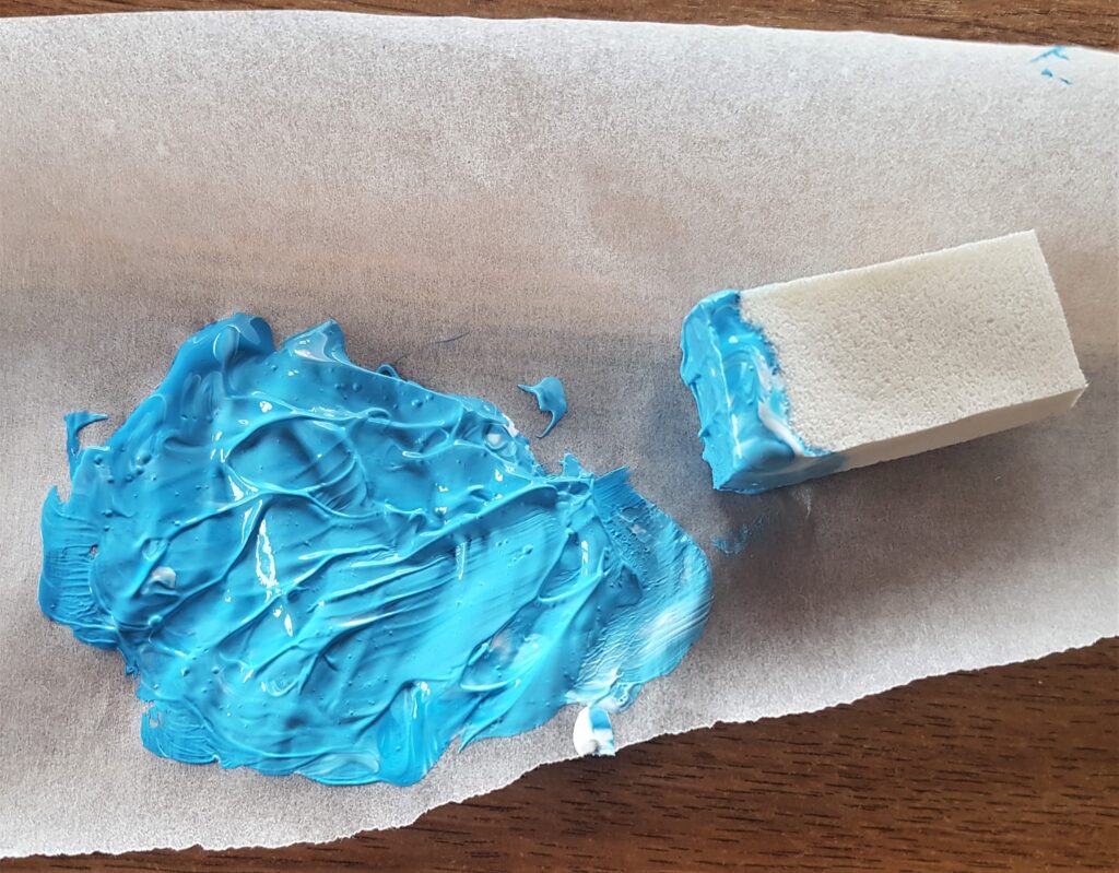 Two colour Paints mixed together to make a lighter shade blue.